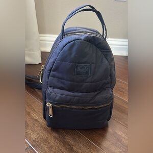 Herschel Supply Co. Nova Mini Backpack in black with gold-toned zippers